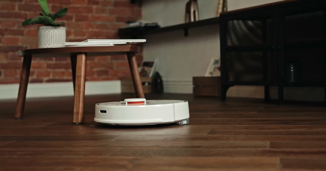 Robot vacuum cleaning a living room floor